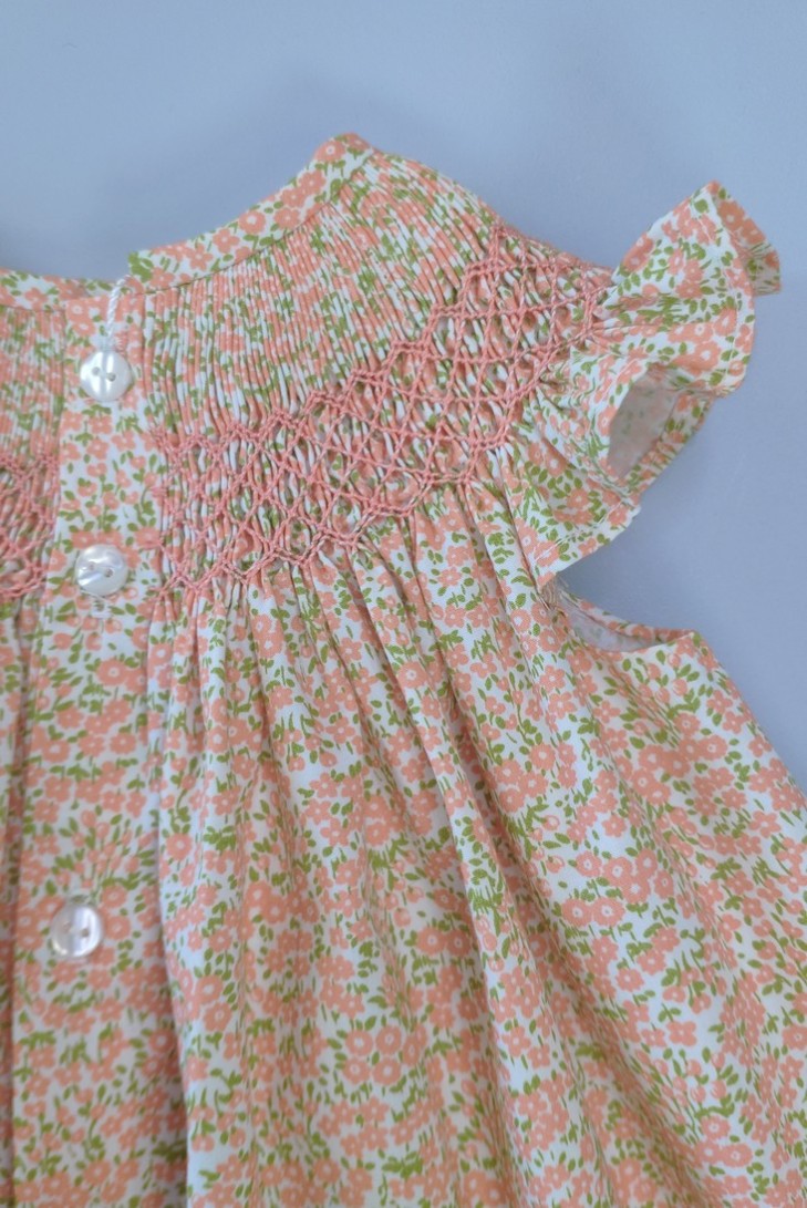 VESTIDO PUNTO SMOCK FLORES, NARANJA. VERANO 24.