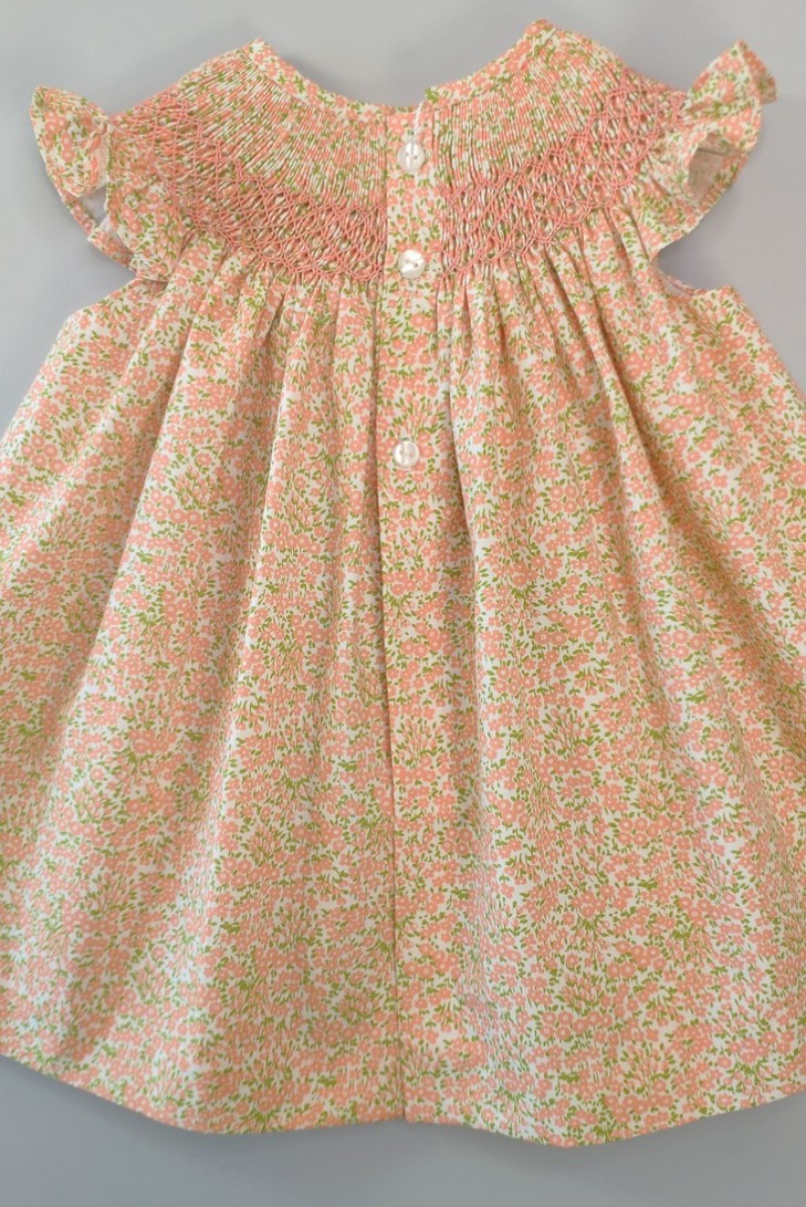 VESTIDO PUNTO SMOCK FLORES, NARANJA. VERANO 24.