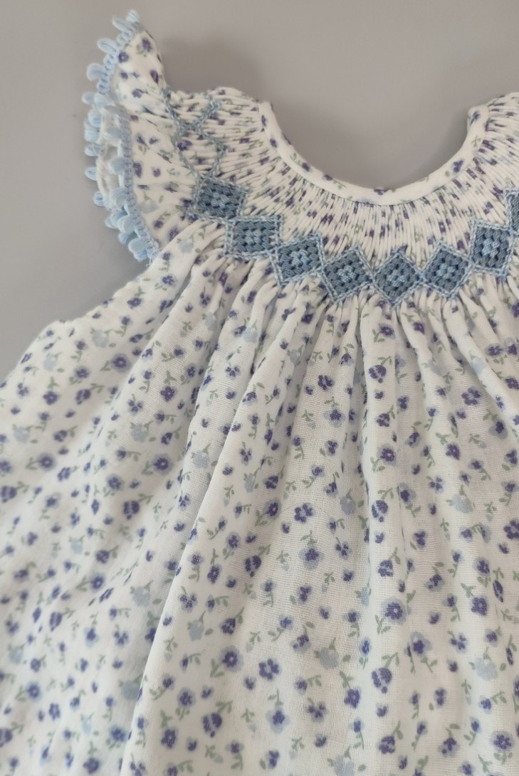 JESUSITO PUNTO SMOCK BÁMBULA "DAISY", FLORES AZUL. VERANO 24.