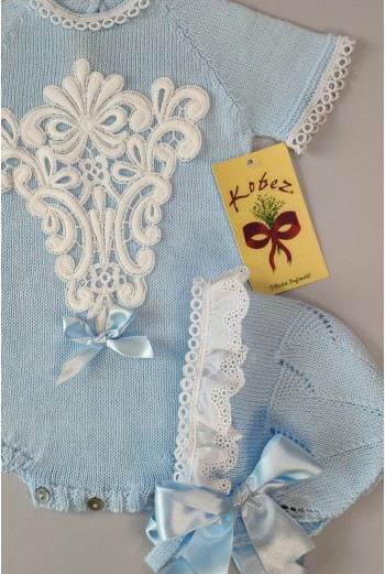 PELELE DE PUNTO UNISEX, CELESTE. INCLUYE CAPOTA. VERANO 2
