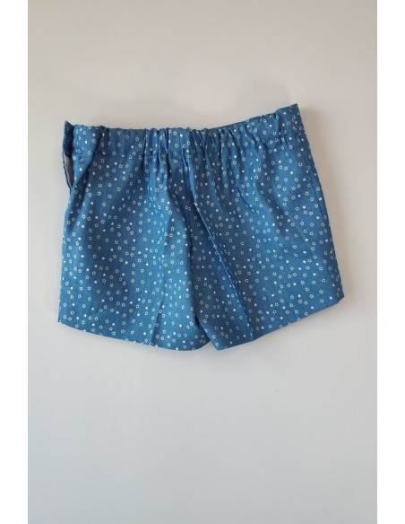 Conjunto niño formado por camisa estampado rayas y pantalón short en tela vaquera con decoración de anclas